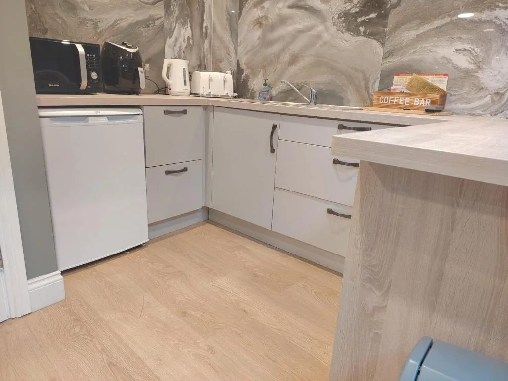 Kitchenette with microwave, air fryer, kettle and toaster