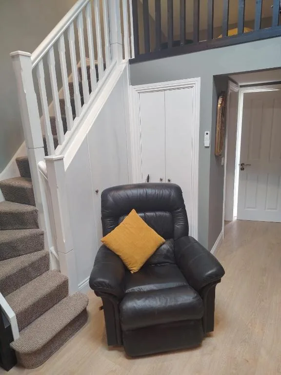 Carpeted staircase leading up to the loft bedrooms